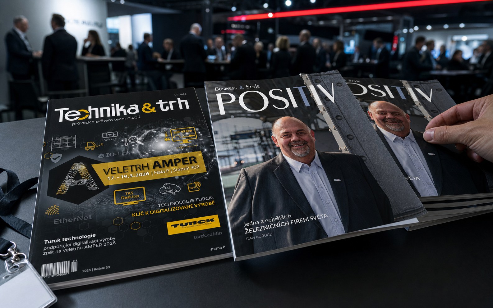 Vydání časopisů Technika & trh a POSITIV Business & Style vedle sebe na stole veletržního stánku